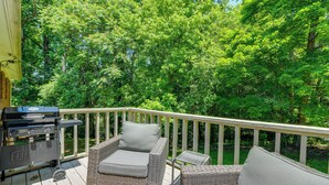 A deck with wicker furniture and a grill. - Charming Jonesville Home w/ Grill - Near Wineries! (Jonesville)