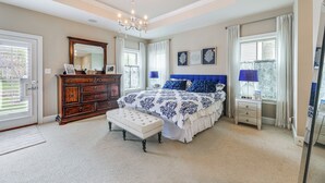A bedroom with a large bed, a dresser, a bench, and a desk. - Furnished Outdoor Space: Family Home in Ocean View (Ocean View)