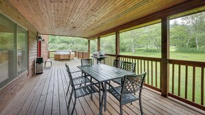 A wooden deck with a table and chairs, a barbecue grill, and a hot tub. - Slaty Fork Home ~ 6 Mi to Snowshoe Mountain Resort (Snowshoe)
