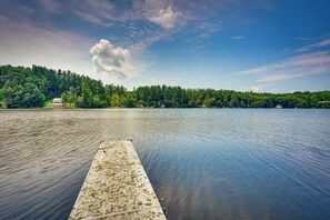A dock extending into calm water with a forested shoreline in the background. - Monterey Haven < 1/2 Mi to Lake Garfield w/ Kayaks (Monterey)