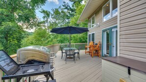 A deck with a grill, outdoor table, chairs, and an umbrella. - 40-acre Ararat Escape: On-site Trails & Mtn Views! (Hillsville)