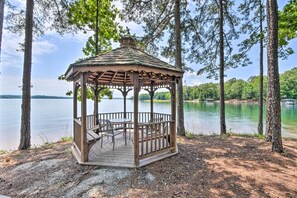 A wooden gazebo with a roof, surrounded by trees, overlooking a lake. - Walk to Lake Keowee: Salem Townhome w/ Deck (Salem)