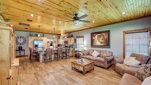 A spacious living area with a wooden ceiling, a dining area, and a kitchen. - Jefferson Vacation Rental With Golf Cart! (Jefferson)