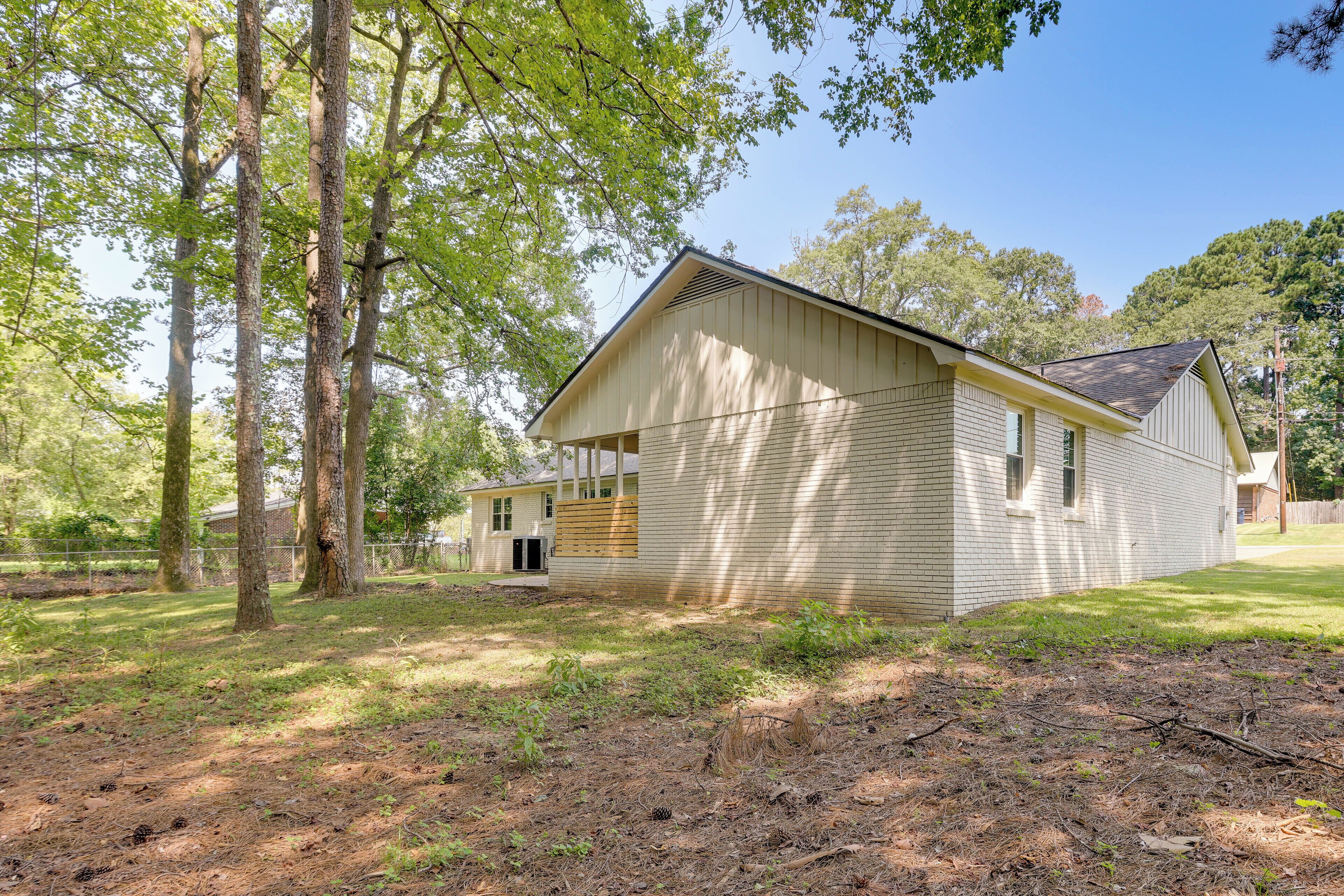 A two-story house with a gabled roof and a front porch.