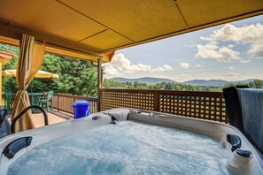 A hot tub on a deck with a view of mountains and trees. - Cozy Cabin w/ Deck & Hot Tub in Blue Ridge Mtns! (Sparta)