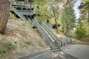 A staircase leading up a hillside with a building in the background.