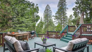 A wooden deck with outdoor furniture, a grill, and a staircase leading to a deck. - Mi-wuk Village Vacation Rental w/ Multi-level Deck (Mi-Wuk Village)