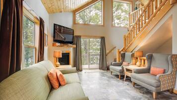 House (2 Bedrooms) | Living area | TV, fireplace, books