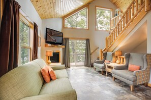 House (2 Bedrooms) | Living area | TV, fireplace, books - Lakefront Wisconsin Cabin: Dock, Walk to Beach! (Townsend)