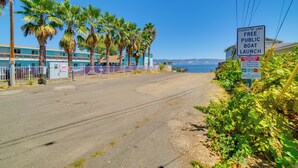 A coastal road with a sign for a free public boat launch.