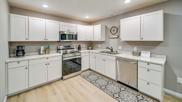 A modern kitchen with white cabinets, a microwave, an oven, and a dishwasher. - Serene Dry Ridge Vacation Rental w/ Nearby Fishing (Dry Ridge)