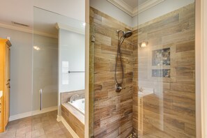 A modern bathroom with a glass-enclosed shower, a bathtub, and a wooden-tiled shower wall. - Muscle Shoals Home < 3 Mi to Recording Studios! (Muscle Shoals)