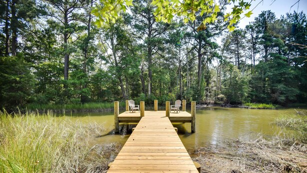 A wooden dock leading to two wooden platforms with chairs. - Mobjack Bay Rental on Private Cove! (Bohannon)