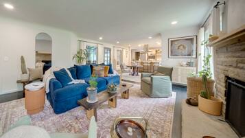 House (3 Bedrooms) | Living area | TV, fireplace, books