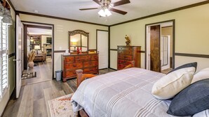 A bedroom with a bed, dresser, and ceiling fan. - Dog-friendly Home w/ Mtn Views in Chilhowie! (Chilhowie)