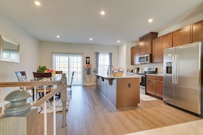 A modern kitchen with wooden cabinets, stainless steel appliances, and a central island. - Spacious Hedgesville Retreat ~ 5 Mi to Golf Course (Hedgesville)