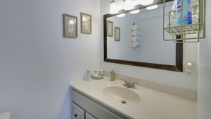 A bathroom with a large mirror, a sink, and a towel rack. - Pet-friendly Caneadea Retreat With Deck! (Belfast)