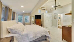 A bedroom with a bed, a TV, a wardrobe, and a ceiling fan. - Upper Black Eddy Home w/ Delaware River Access! (Upper Black Eddy)