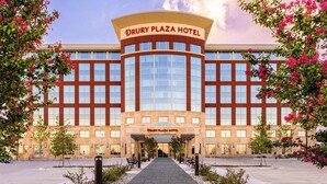 The Drury Plaza Hotel with a central entrance, large windows, and a symmetrical facade. - Drury Plaza Hotel Dallas Arlington (Arlington)