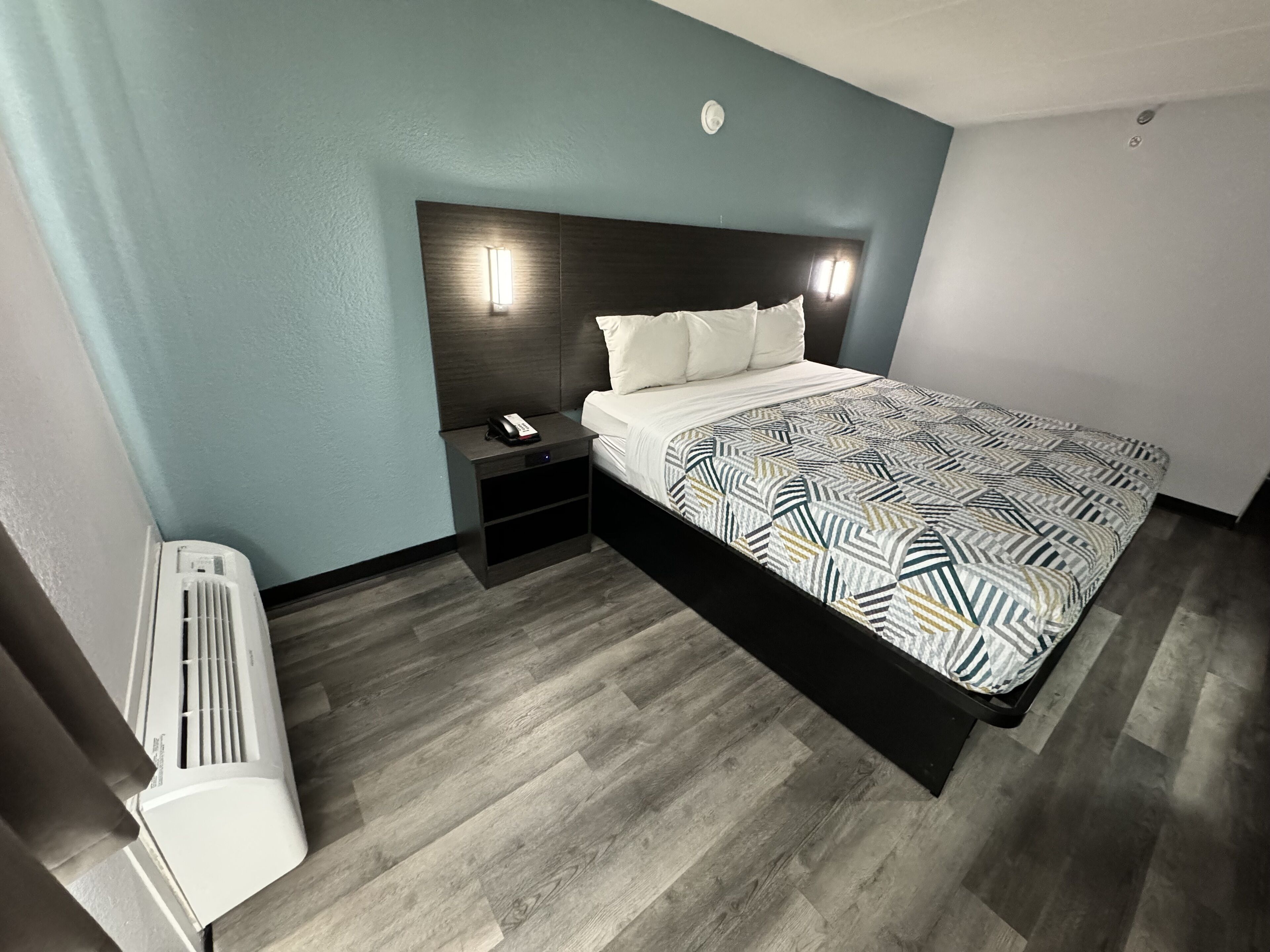 pillow-top beds, desk, laptop workspace, blackout curtains