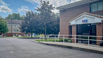 A parking lot with a building labeled "6 COTTAGE" in the background.