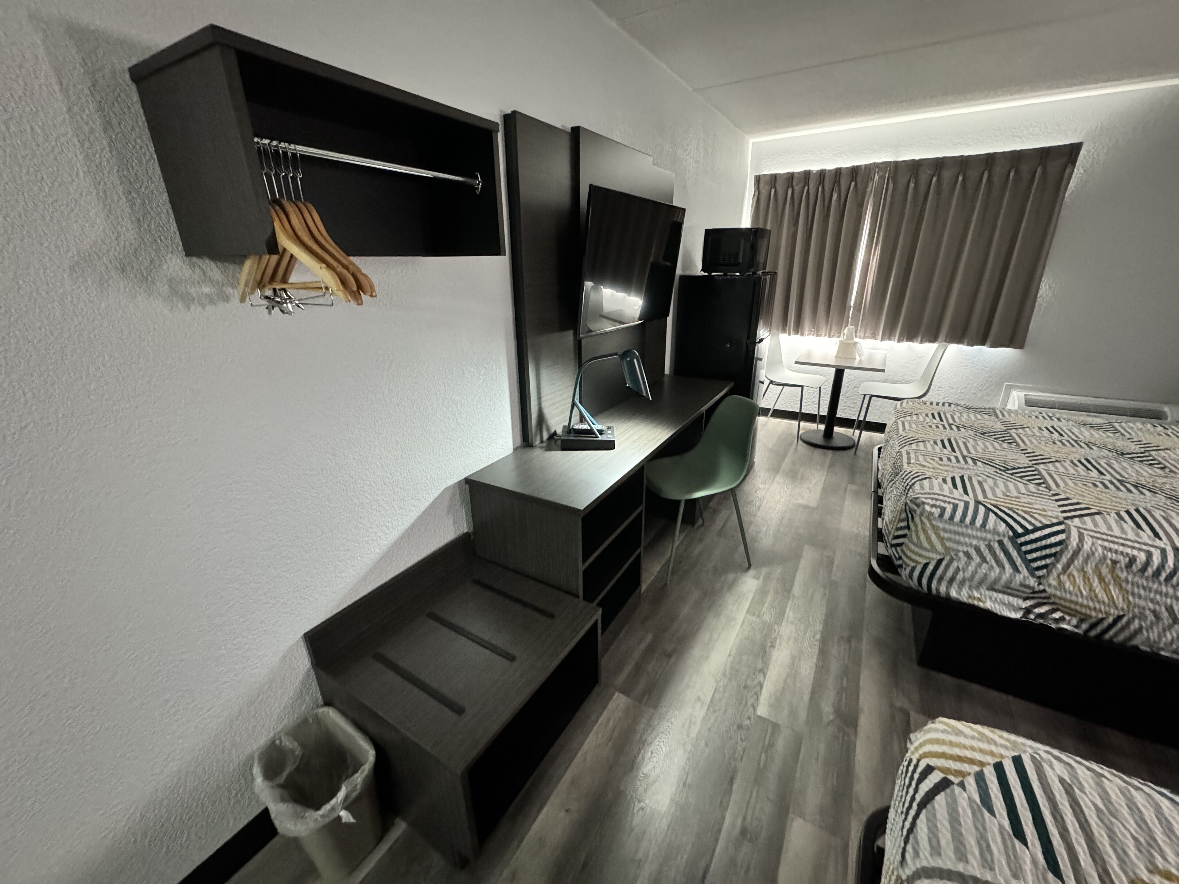 pillow-top beds, desk, laptop workspace, blackout curtains