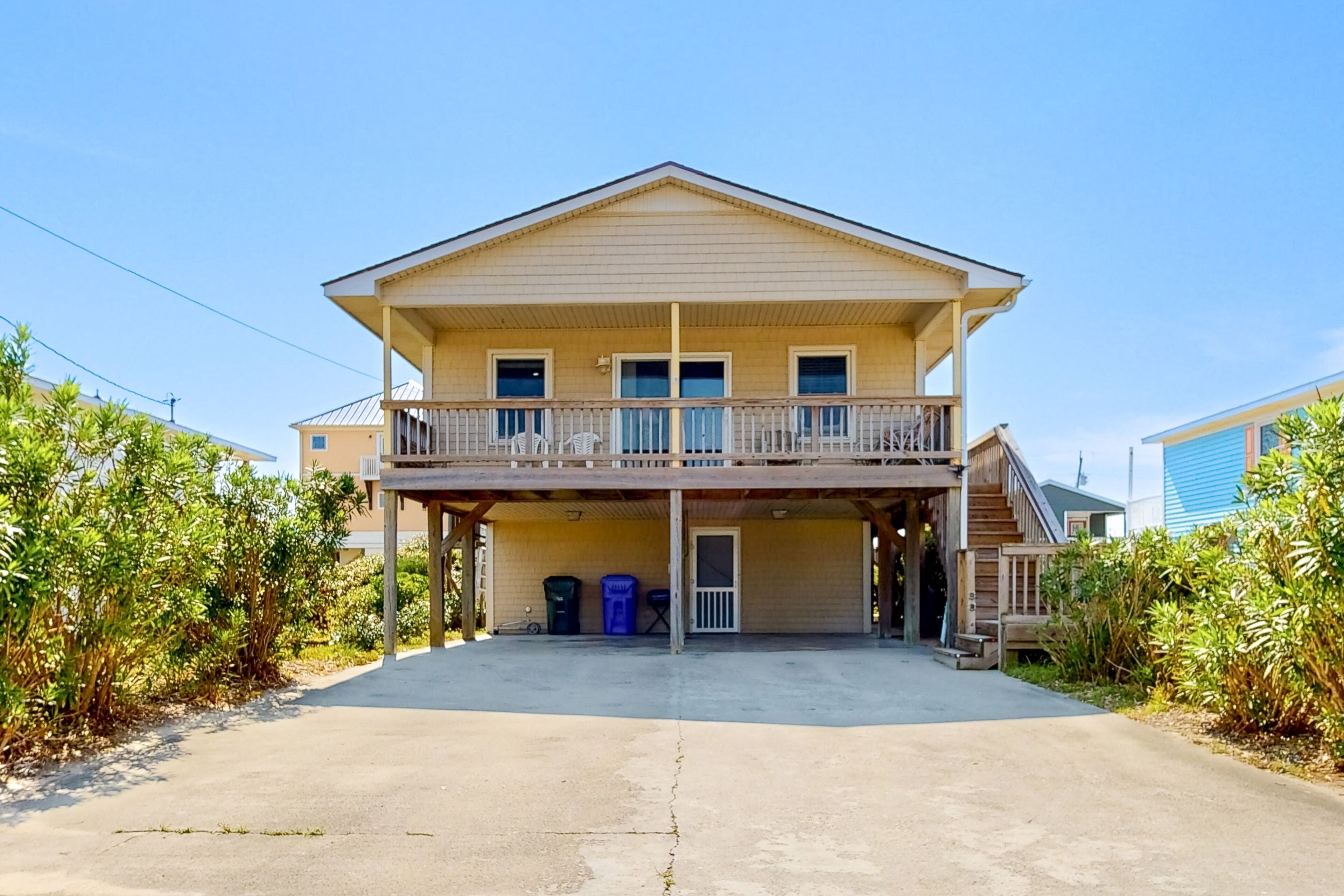 Dog-friendly 2-story home near the beach with deck, partial water views, W/D