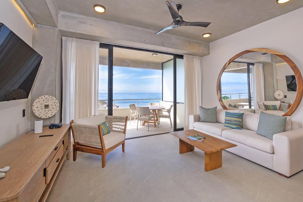 Deluxe Condo, 2 Bedrooms, Beach View 305 | Living area | 60-inch flat-screen TV with digital channels