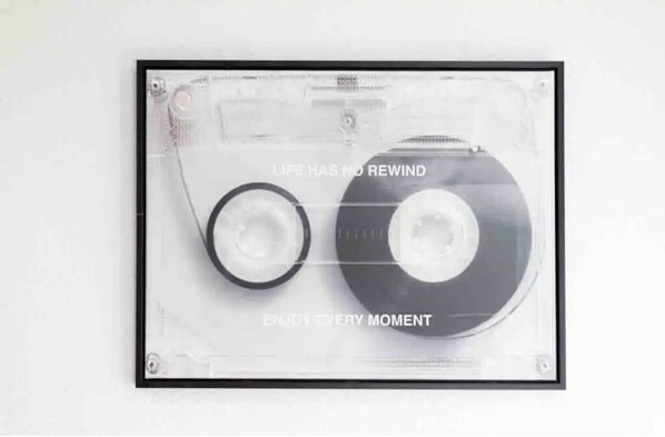 A cassette tape with the text "LIFE HAS NO REWIND" and "ENJOY EVERY MOMENT" on it. - Family Oasis 10 min from Fiesta Tx (San Antonio)