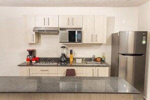 Fridge, microwave, cookware/dishes/utensils