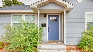 A house with a blue front door, white porch steps, and a mailbox. - Updated Home w/ Yard ~ 14 Mi to Quartz Mountain! (Mangum)