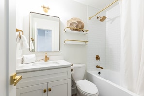 Bathroom in hallway for second bedroom.