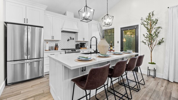 A modern kitchen with a central island, stainless steel appliances, and pendant lighting. - Modern 2-Bed Family Haven 🏡 Pet-Friendly + EV Charging 🐾⚡ (San Jose)
