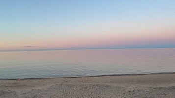 On the beach, sun-loungers, beach towels