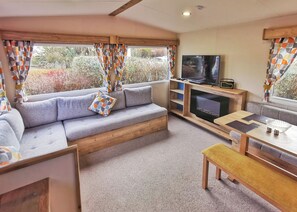 Living area - Spacious and well presented 12ft wide caravan with one double and two twin. (Ludchurch, Nr Saundersfoot)