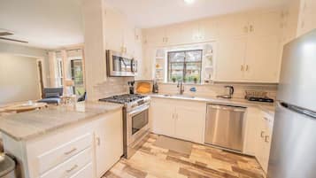 Dishwasher, coffee/tea maker, highchair, cookware/dishes/utensils