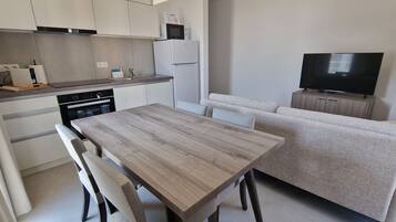 Economy Studio | Living area | 100-cm Smart TV with cable channels, heated floors