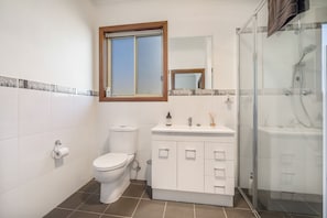 Bathtub, hair dryer, towels, soap