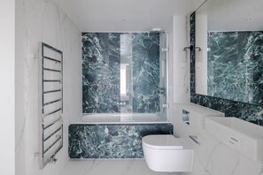 Bathtub, hair dryer, towels