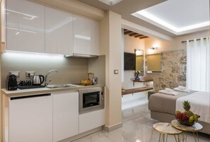 Fridge, microwave, stovetop, coffee/tea maker