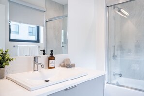 Bathtub, hair dryer, towels