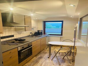 Fridge, microwave, stovetop, coffee/tea maker