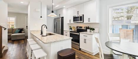 Microwave, dishwasher, coffee/tea maker, cookware/dishes/utensils