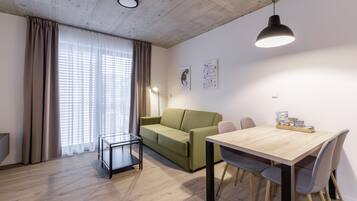 Superior Apartment | Living area | 50-inch LCD TV with cable channels