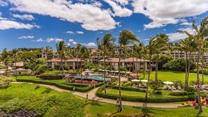 A resort with multiple buildings, a swimming pool, and well-maintained lawns. - Wailea Beach Villas M312 3 Bedroom Condo (Kihei)