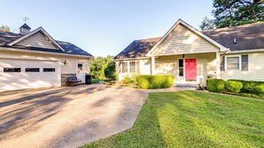 A residential street with two houses, each with a garage and a front door. - Pet-friendly New Concord Vacation Rental on Lake! (New Concord)