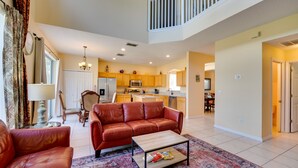 TV, books - Spacious Kissimmee Vacation Rental w/ Private Pool (Kissimmee)