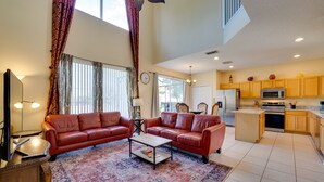 TV, books - Spacious Kissimmee Vacation Rental w/ Private Pool (Kissimmee)