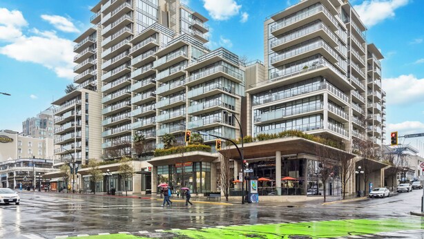 A modern high-rise building with multiple balconies and a ground-level commercial area. - Waterfalls Hotel - Kings Corner - Resort Living (Victoria)