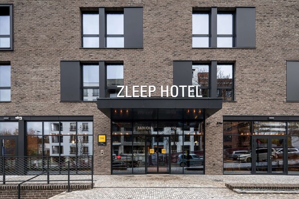A brick building with a sign that reads "ZLEEP HOTEL". - Zleep Hotel Prague (Prague)